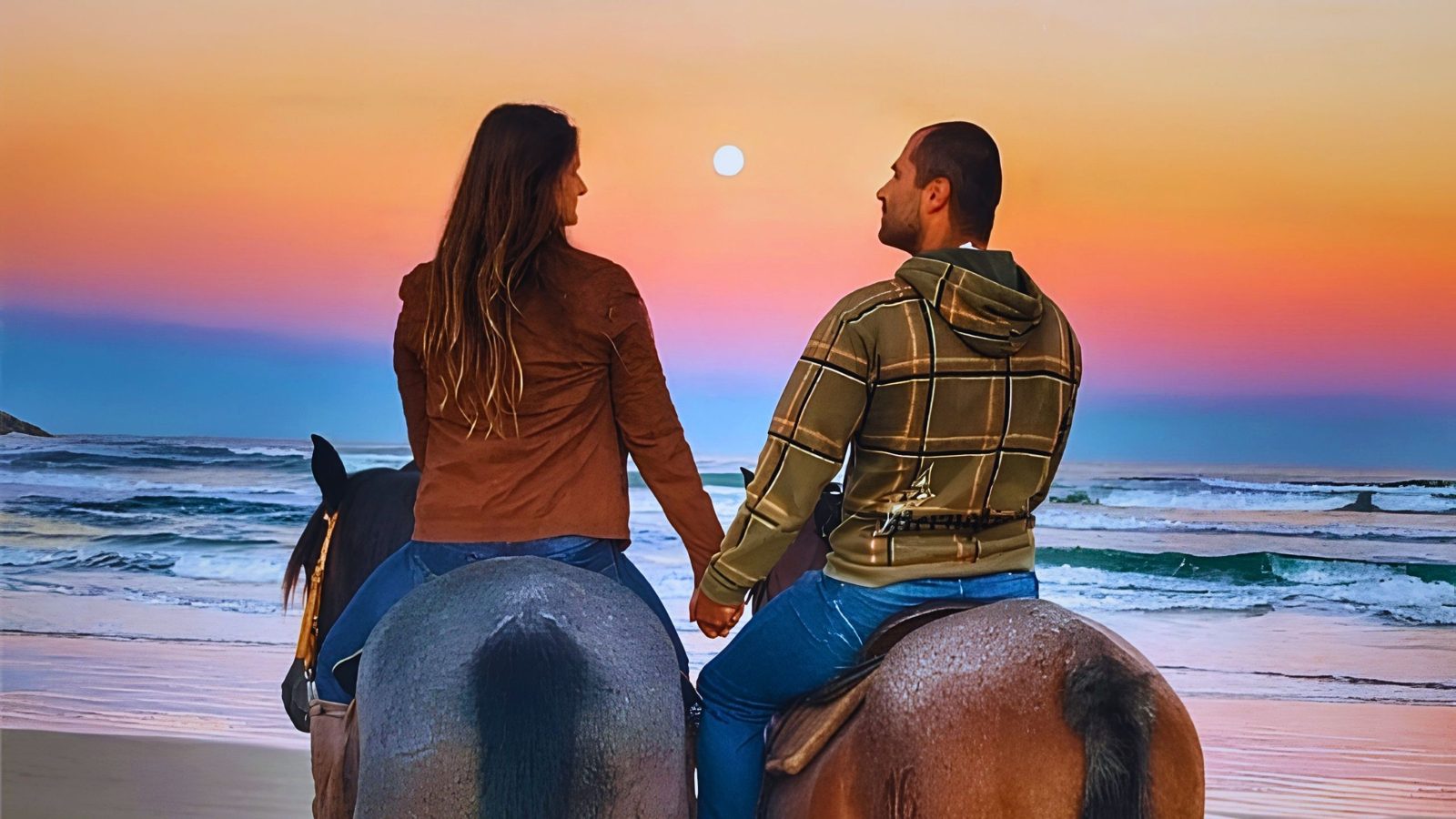 Cavalgada na praia ao pôr do sol
